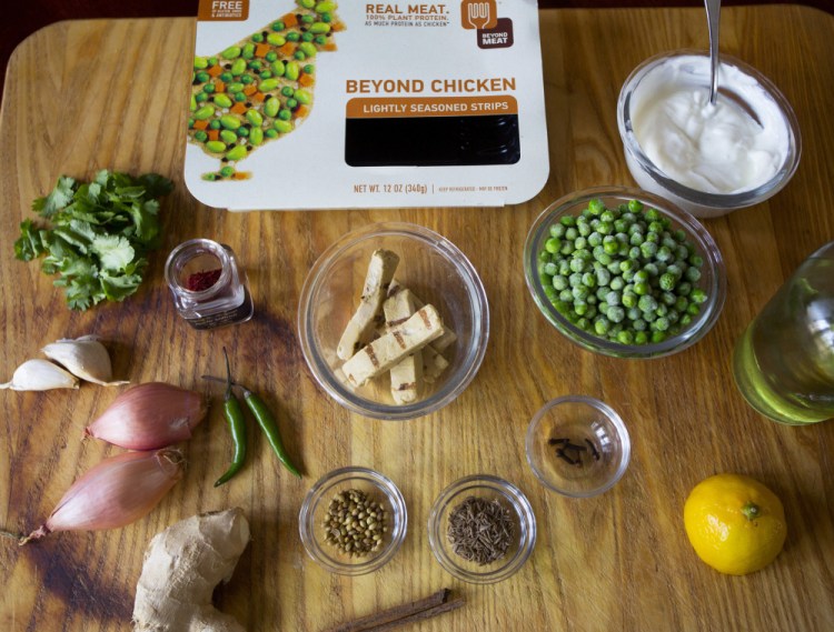 Ingredients for chicken tikka masala using Beyond Meat chicken strips (above). The finished dish is pictured at top, served over rice.