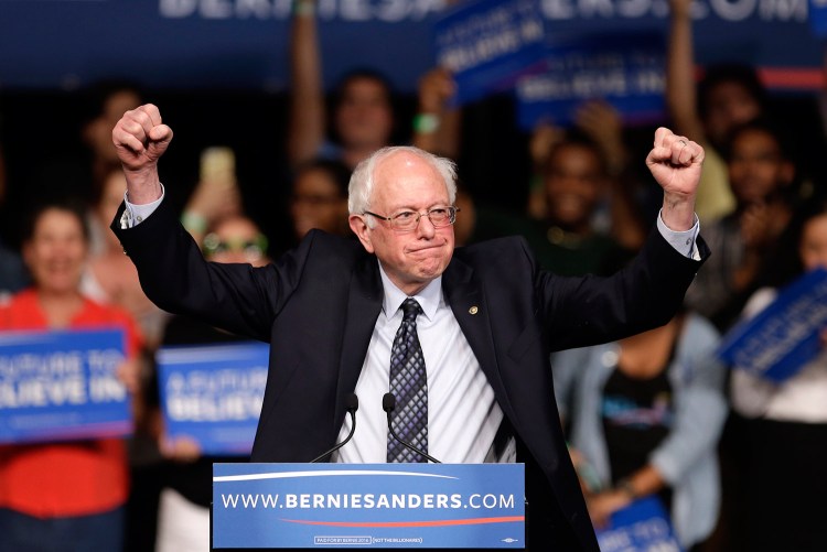 Democratic presidential candidate, Sen. Bernie Sanders, I-Vt. acknowledges his supporters on arrival at a campaign rally Tuesday in Miami. 