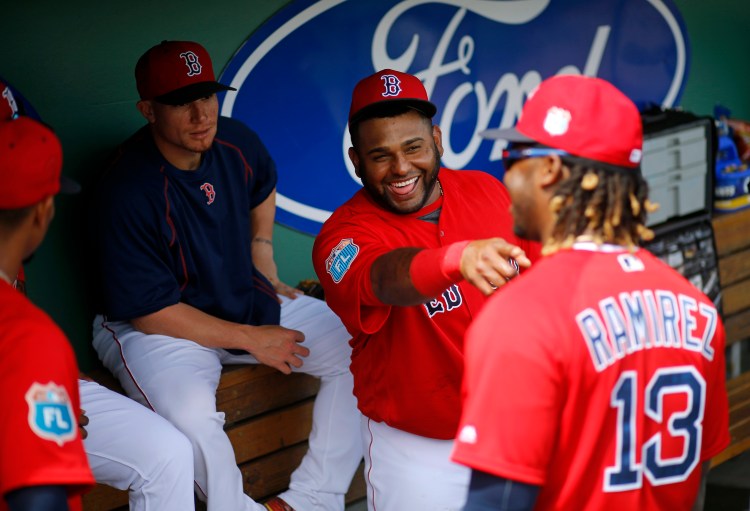 Red Sox third baseman Pablo Sandoval, second from right, seems unbothered by his struggles while teammate Hanley Ramirez says his transition to first base hasn't been easy.   The Associated Press