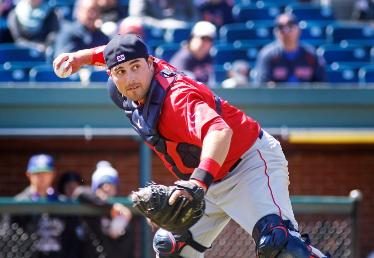 Sea Dogs' catcher Ali Solis grabs a bunt and throws to first. The ball was dropped by first baseman Jordan Weems in the third inning of Portland's game against the Hartford Yard Goats at Hadlock Field. 