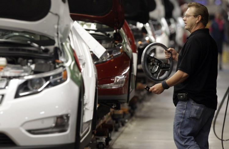 Detroit auto workers like this one are paid far more than those in Mexico. Ford factory workers get about $60 per hour in wages and benefits, while those in Mexico average about $8 per hour, an industry think tank says.