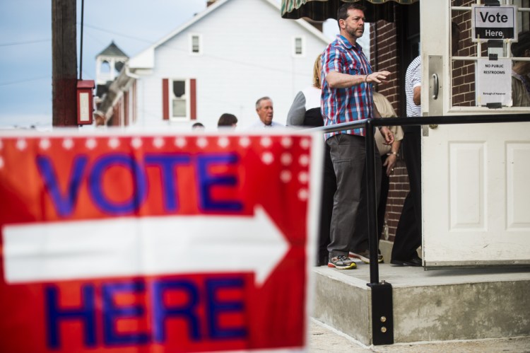 Voters line up to enter at the Hanover Market House polling station in the 2nd ward Tuesday in Hanover, Pa., borough. Although Pennsylvania has the largest number of delegates up for grabs Tuesday, it's more of a wild card than the other states.