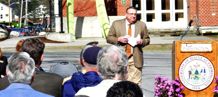 Gov. Paul LePage abruptly leaves the lectern while speaking during a dedication of the Theodora J. Kalikow Education Center at the University of Maine at Farmington after students held up posters critical of him on Tuesday.