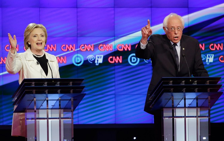 Bernie Sanders and Hillary Clinton try to speak over each other during Thursday night's debate.
The Associated Press