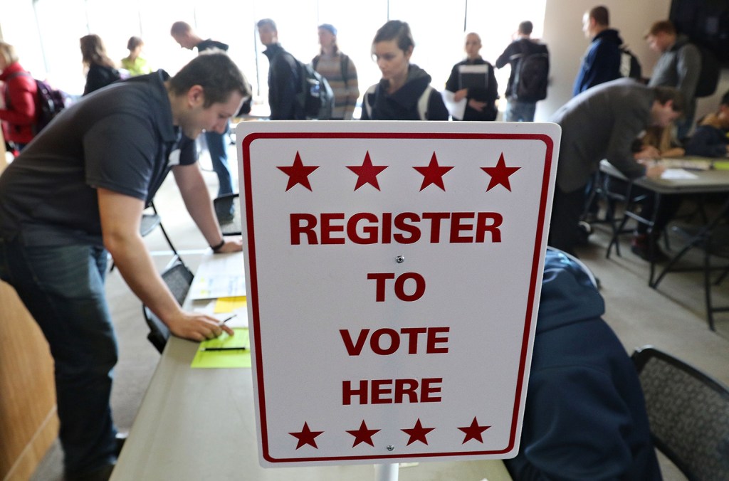 Students wait in long lines to register and vote Tuesday at the University of Wisconsin-Eau Claire. Wisconsin voters were expected to turn out in large numbers for Tuesday's presidential primary and statewide races.