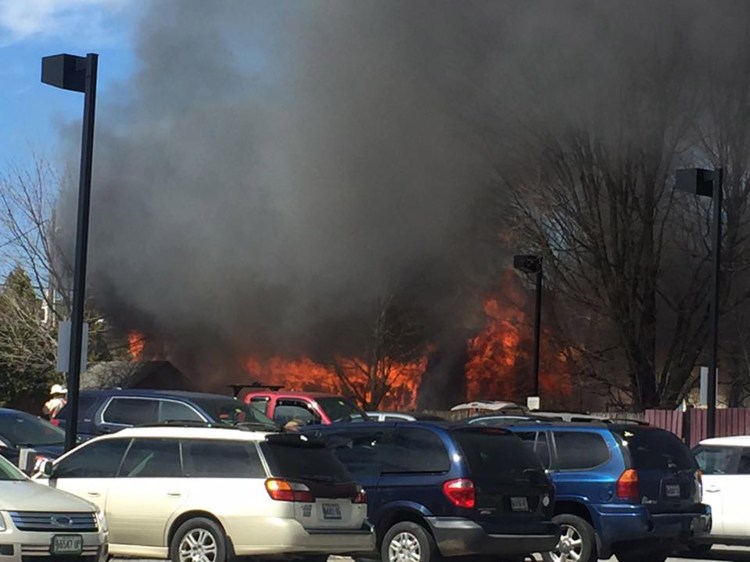 Flames show from a fire in Gray's business district Thursday.