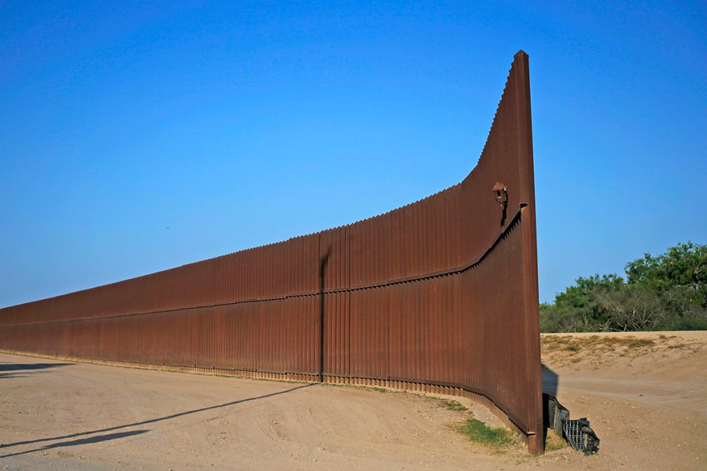 A break in the fence at the United States-Mexico border is seen outside of Brownsville, Texas, in this Aug. 5, 2014, photo. Throughout the campaign, Donald Trump has claimed that he could complete his proposed U.S.-Mexico barrier for about $8 billion. Reuters