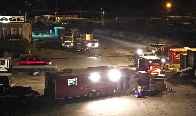 Members of South Portland's hazmat regional response team investigate the scene of a chlorine leak Wednesday morning at Rigby Yard. The department has two hazmat trailers – one for response and the other for decontamination operations. Photo courtesy WCSH