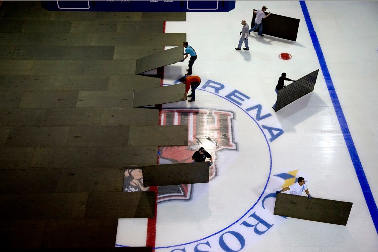 The crew at the Cross Insurance Arena prepares for a Portland Pirates game in October 2014. Four groups have submitted proposals to bring pro hockey back to Portland.