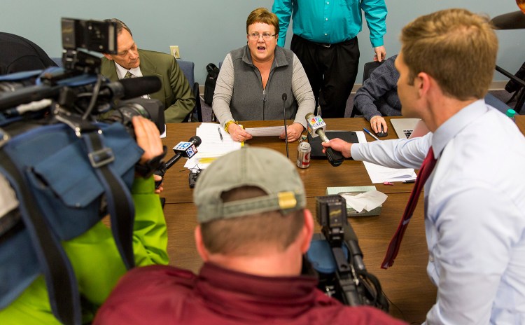 SAD 6 board chair Rebecca Bowley talks to reporters Monday after announcing the resignation of superintendent Frank Sherburne. 