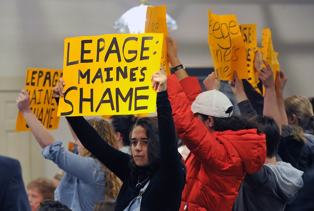 Protesters turned out for Gov. Paul LePage's town hall forum Wednesday in Lewiston. The group was escorted out of the event.
Shawn Patrick Ouellette/Staff Photographer