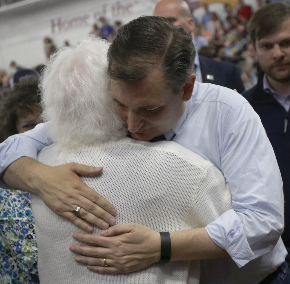 Sen. Ted Cruz, R-Texas, hugs a supporter at a campaign rally in Lafayette, Ind., on Sunday.