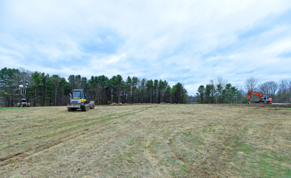 Land is cleared off Washington Street in Oakland so Colby College can lease a large solar installation that will go live by early next year. NRG Energy will build and own the project.