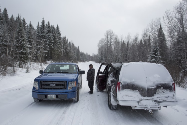 <b>THE NORTH WOODS:</b> Carter McBreairty stops to talk with a friend while touring forestland north of Allagash owned by Irving Woodlands.