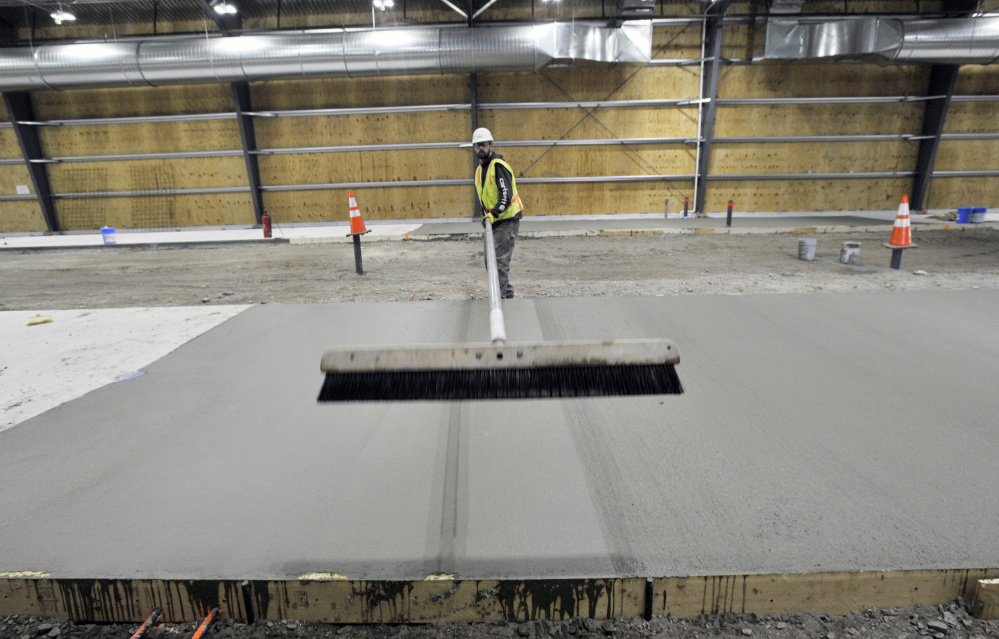 Justin Woodcock of Concrete Craftsmen, based in North Monmouth, works on the Downeaster layover station. Maine had 3,389 specialty contractors in 2015, down 34 percent from 5,171 in 2001, according to state data.