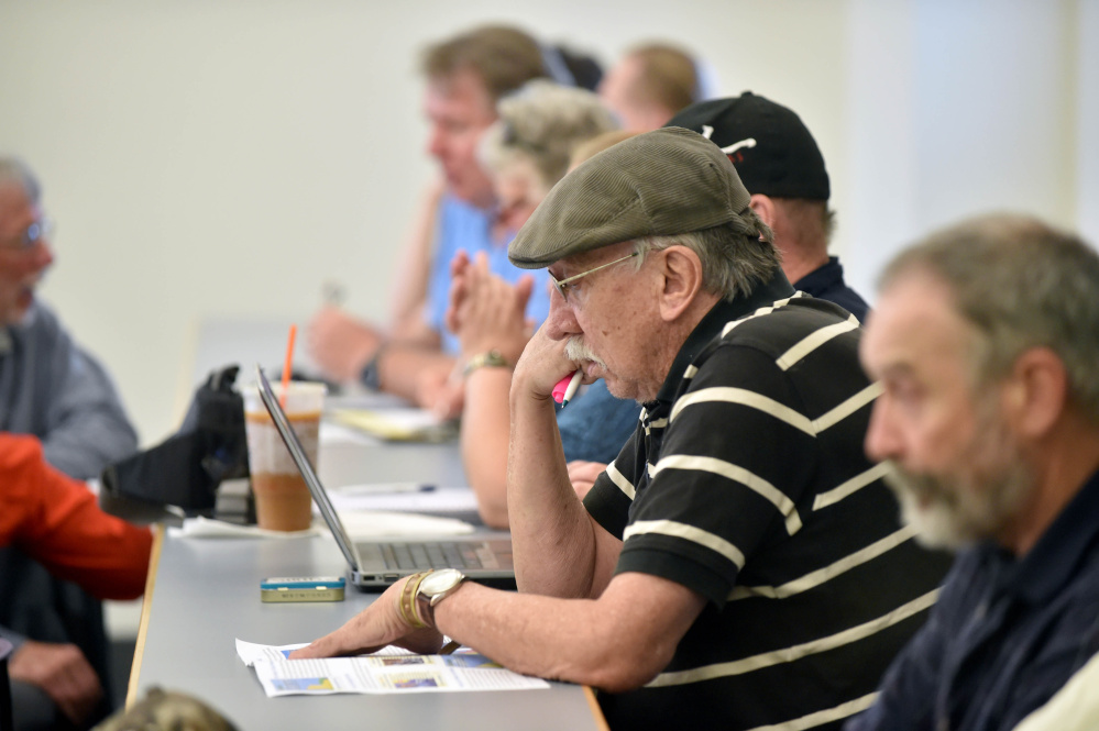 People gather on Thursday in the Diamond Building for The Future of Solar in Maine Forum at Colby College in Waterville.