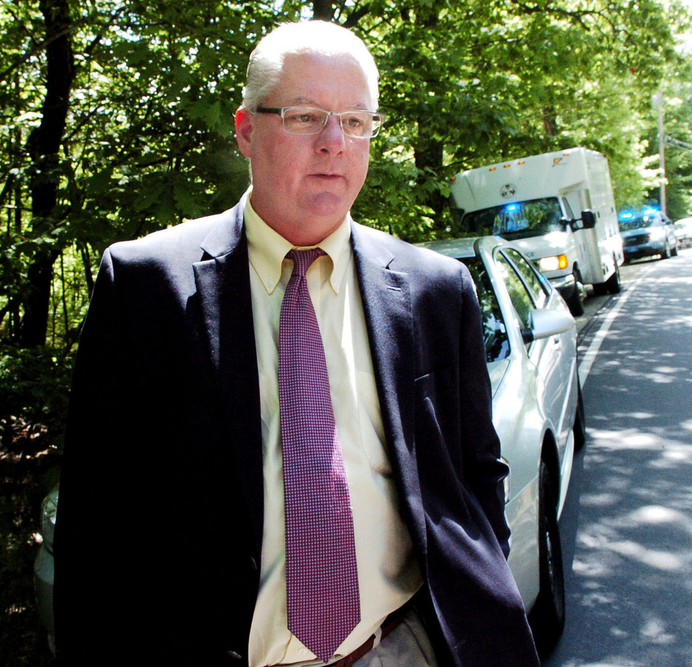 Lt. Brian McDonough of the Maine State Police speaks with reporters outside the property at 259 Weld Road in Wilton where Michael Reis died early Wednesday morning.