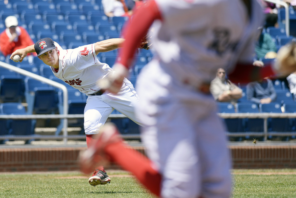 Portland third baseman Sean Coyle attempts to throw out a Reading runner during Reading's 15-9 victory Thursday.