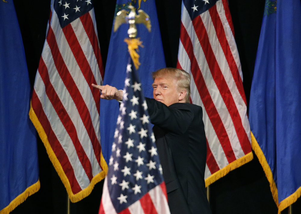 Associated Press/John Locher
Republican presidential candidate Donald Trump reacts after speaking at the Treasure Island hotel and casino in Las Vegas on Saturday. A recent poll rates his favorable at a crippling 29 percent.