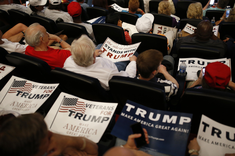 Supporters wait for Republican presidential candidate Donald Trump on Saturday in Las Vegas. Hillary Clinton leads in polls.