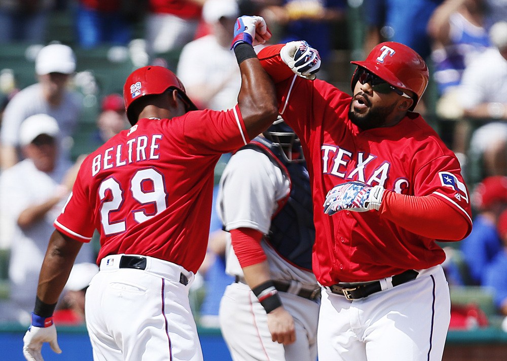 Prince Fielder, right, celebrates with Adrian Beltre after hitting a two-run homer for the Texas Rangers in a 6-2 win Sunday over the Red Sox in Arlington, Texas.