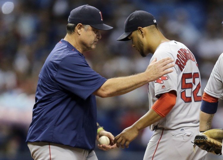 Red Sox manager John Farrell takes the ball from starting pitcher Eduardo Rodriguez in the third inning Monday night in in St. Petersburg, Fla.