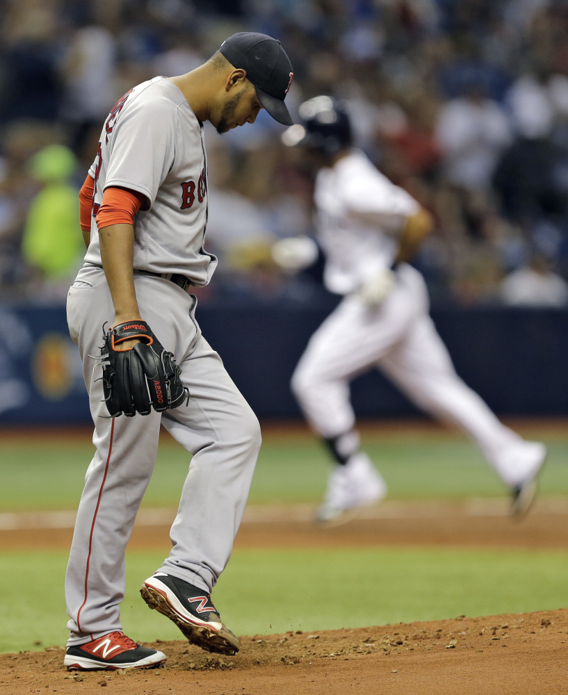 Eduardo Rodriguez kicks the mound as the Rays' Desmond Jennings runs around the bases after his home run in the third inning gave Tampa Bay a 9-0 lead.
