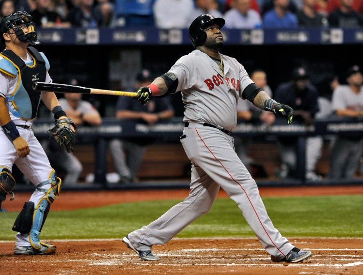 Tampa Bay catcher Hank Conger looks on as Boston's David Ortiz hits a RBI-double to right field during the third inning Tuesday.    Associated Press/Steve Nesius