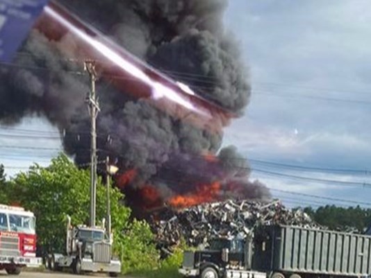 Crews Monday battled a fire at Grimmel's Industries in Topsham, which is located near the Androscoggin River. Photo courtesy of WCSH