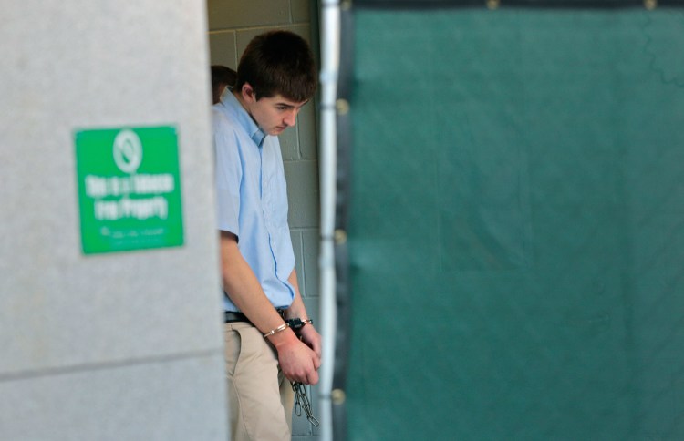 Matthew Gwyer, accused of breaking into a Scarborough home in January and shooting a man as he slept, leaves the Cumberland County Courthouse on Thursday.