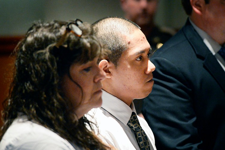 Johnny Ouch appears in the Cumberland County Courthouse in Portland with defense attorney Amy Fairfield to change his plea to guilty on Thursday.