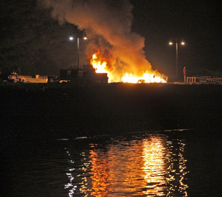 Burning ash ignites a stash of fireworks on the Eastern Promenade on July 4, 2010.