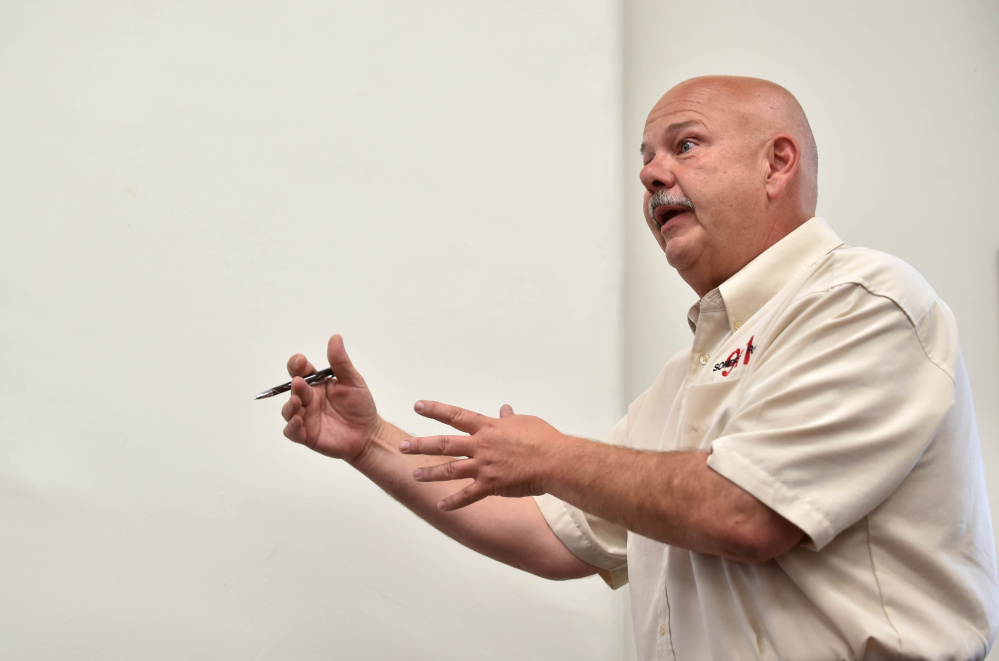 Mike Smith, director of Somerset County Emergency Management Agency, discusses his attempts to get assistance for road repairs in the county's unorganized territory at the Commissioner's Chambers at the Somerset County Superior Court House in Skowhegan on Wednesday.