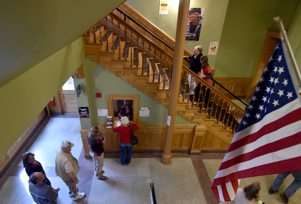 Festivalgoers buy tickets for the Maine International Film festival's opening night film, "Seasons," on Friday at the Waterville Opera House.