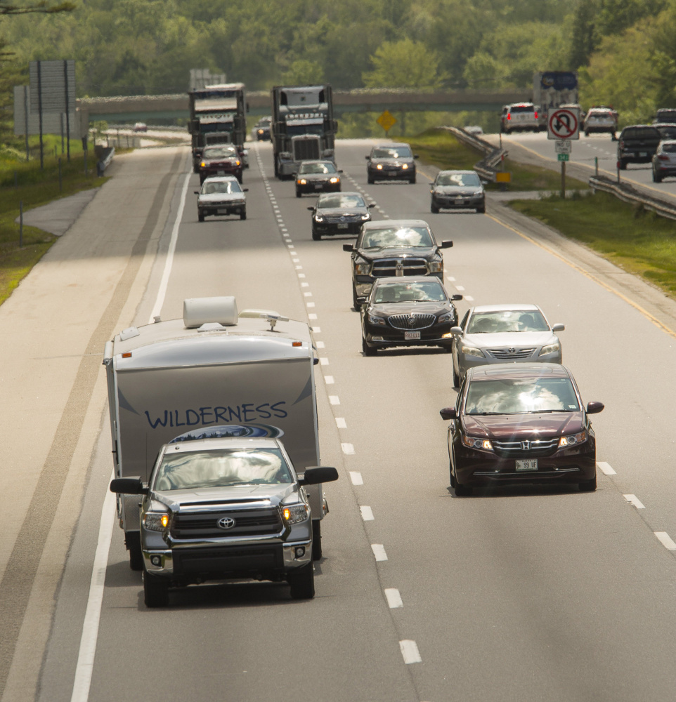 Vehicles head north through Saco on the Maine Turnpike last June. The Maine Turnpike Authority got an excellent rating on its roughly $380 million in outstanding revenue bonds from Fitch Ratings on Monday. The rating reflects the financial strength of the authority, which has the flexibility to absorb the cost of future widening projects without raising tolls, said authority director Peter Mills. Carl D. Walsh/Staff Photographer