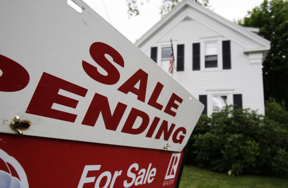 A sale pending sign sits outside a house in Bath. The median sales price for existing, single-family homes in Maine rose by 5.5 percent in June, according to a report issued Thursday by the Maine Association of Realtors.