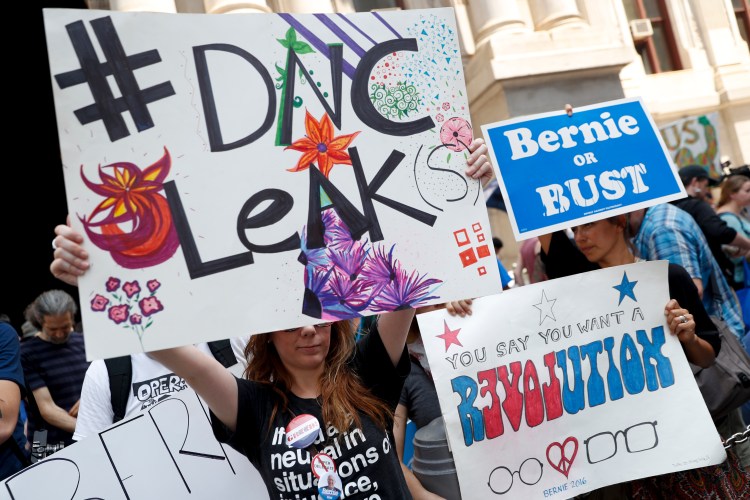 Demonstrators make their way around downtown Philadelphia during the first day of the Democratic National Convention on Monday. (Associated Press/John Minchillo)