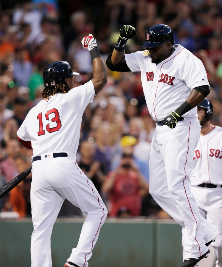 David Ortiz celebrates with Hanley Ramirez after Ortiz hit a three-run home run Tuesday night.    Associated Press/Charles Krupa