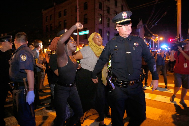 Police arrest Black Lives Matter protesters blocking Commercial Street in Portland on July 15. (Michele McDonald/Staff Photographer)