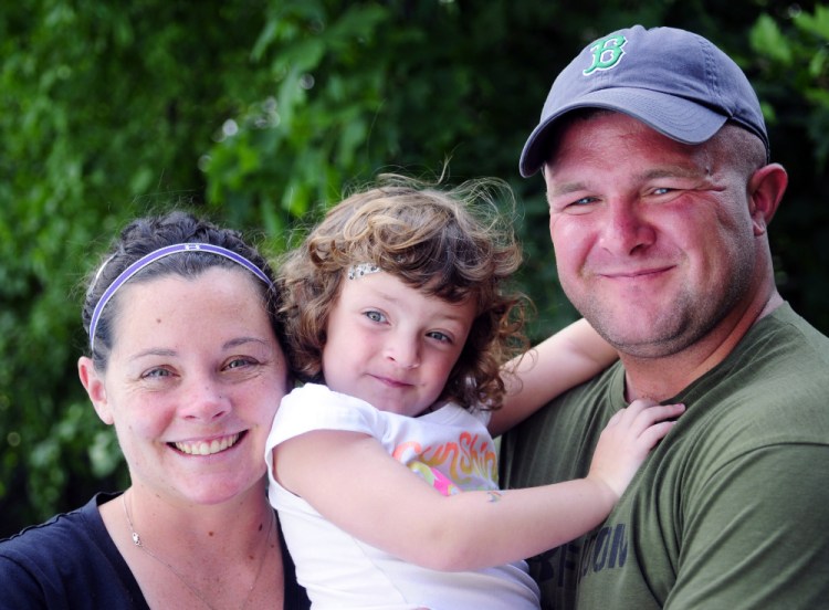 Suzanne Myers, left, and U.S. Army Sgt. Cody Myers with their daughter, Addison, on a visit with family in Augusta.