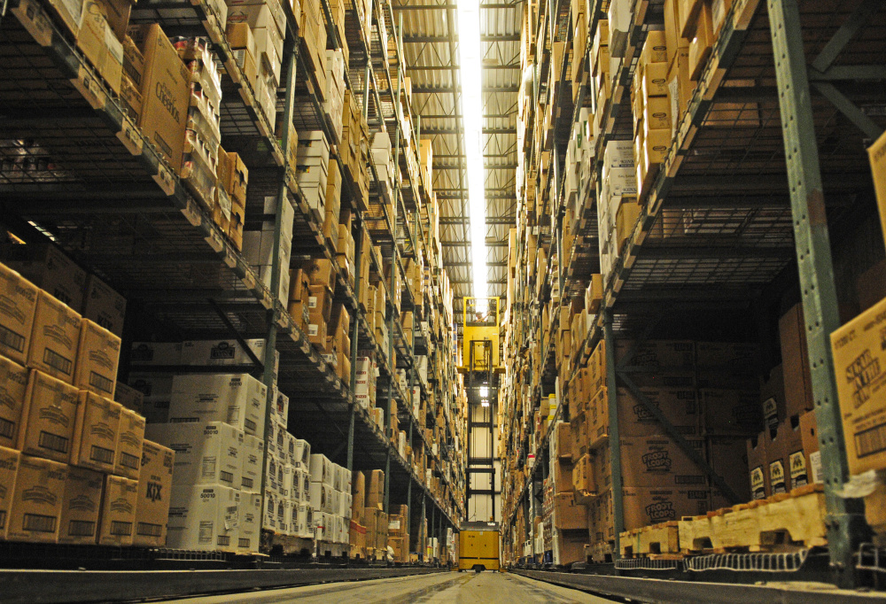 An employee in a forklift works Friday at Performance Foodservice in Augusta, where a $15 million expansion is planned.