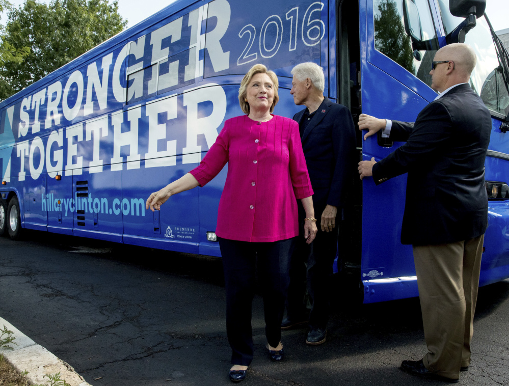 Democratic presidential nominee Hillary Clinton and former President Bill Clinton make a campaign stop last month in Pennsylvania. Their foundation funds health-care, education and environmental initiatives around the world, but has been criticized for taking donations from industries and overseas interests while she was secretary of state.