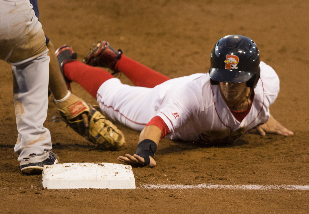 PORTLAND, ME - AUGUST 23: Portland Sea Dogs baserunner Cole Sturgeon gets back to first safely on a pick off attempt against the New Hampshire Fisher Cats in AA baseball action at Hadlock Field in Portland on August 23, 2016 . (Photo by Carl D. Walsh/Staff Photographer)