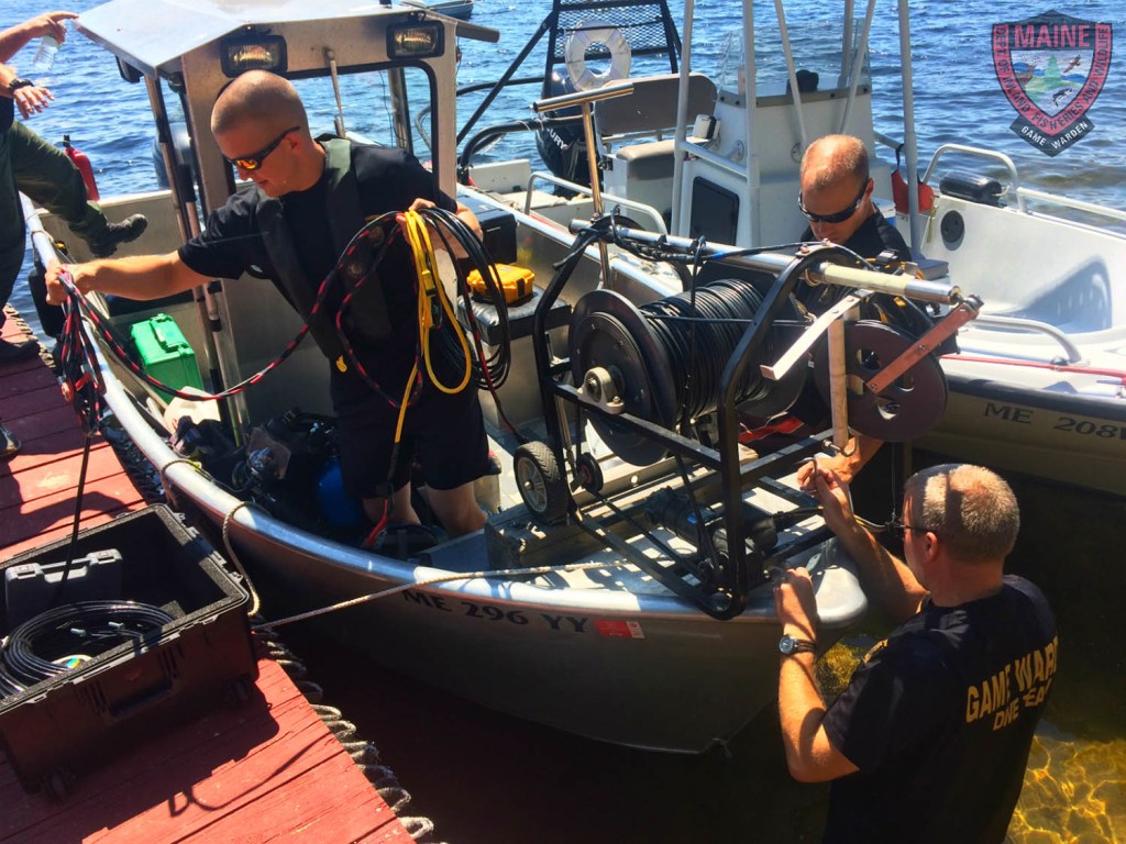 Side scan sonar is fitted to the front of a Maine Warden Service boat Thursday in the search for the teenager from Hollis who fell off a boat in Long Lake on Wednesday.