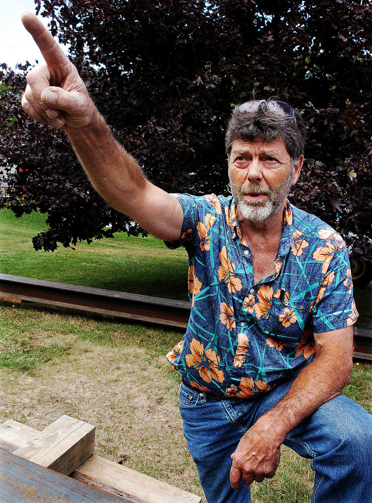 Skowhegan School of Painting and Sculpture grounds and maintenance supervisor Bill Holmes points to where Paco the parrot flew away Thursday.