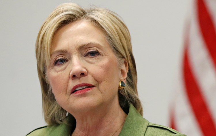 Democratic presidential candidate Hillary Clinton speaks to media as she meets with law enforcement leaders at John Jay College of Criminal Justice in New York on  Aug. 18, 2016. Lawmakers question  the structure and security of Clinton's email system and whether it met federally recommended standards for cybersecurity and record preservation. Carolyn Kaster/Associated Press