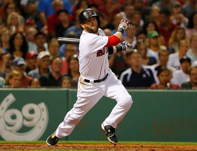 Boston's Dustin Pedroia follows through on his two-run double against the New York Yankees on Tuesday.     Associated Press/Winslow Townson
