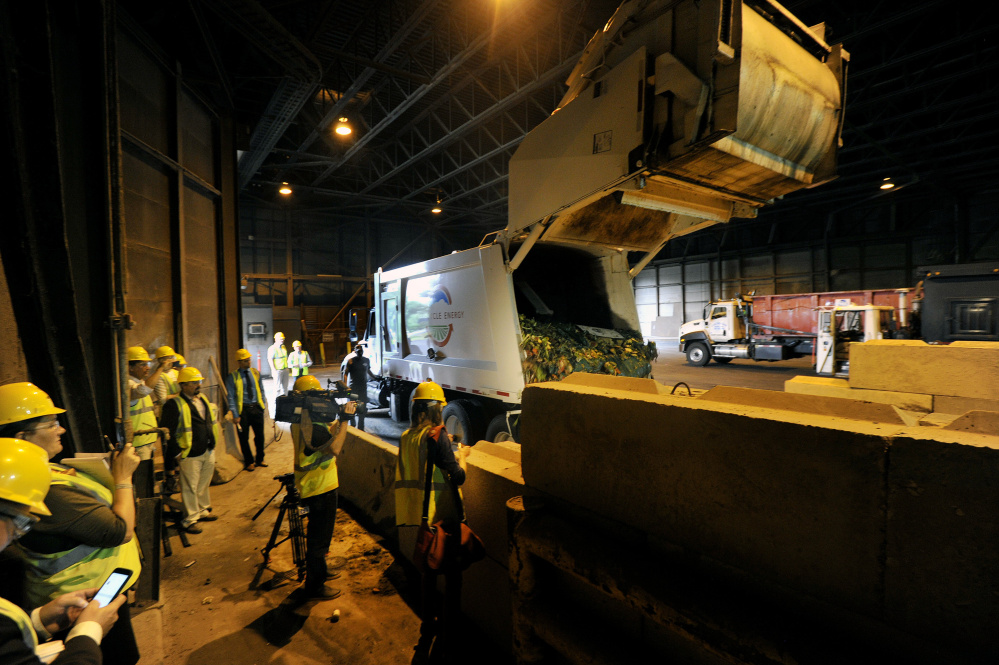 A truck from Agri-Cycle Energy unloads food waste at ecomaine Wednesday.