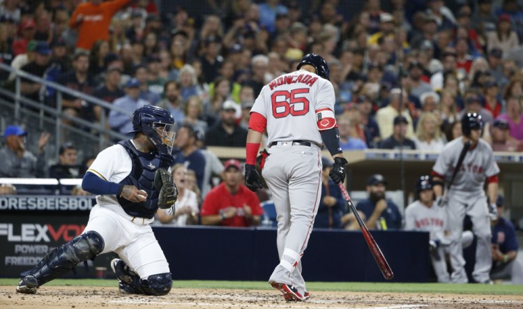 Boston's Yoan Moncada heads back to the dugout after taking a third strike in a game at San Diego last week. Moncada struck out in his final eight plate appearances on the road trip. (AP Photo/Lenny Ignelzi)