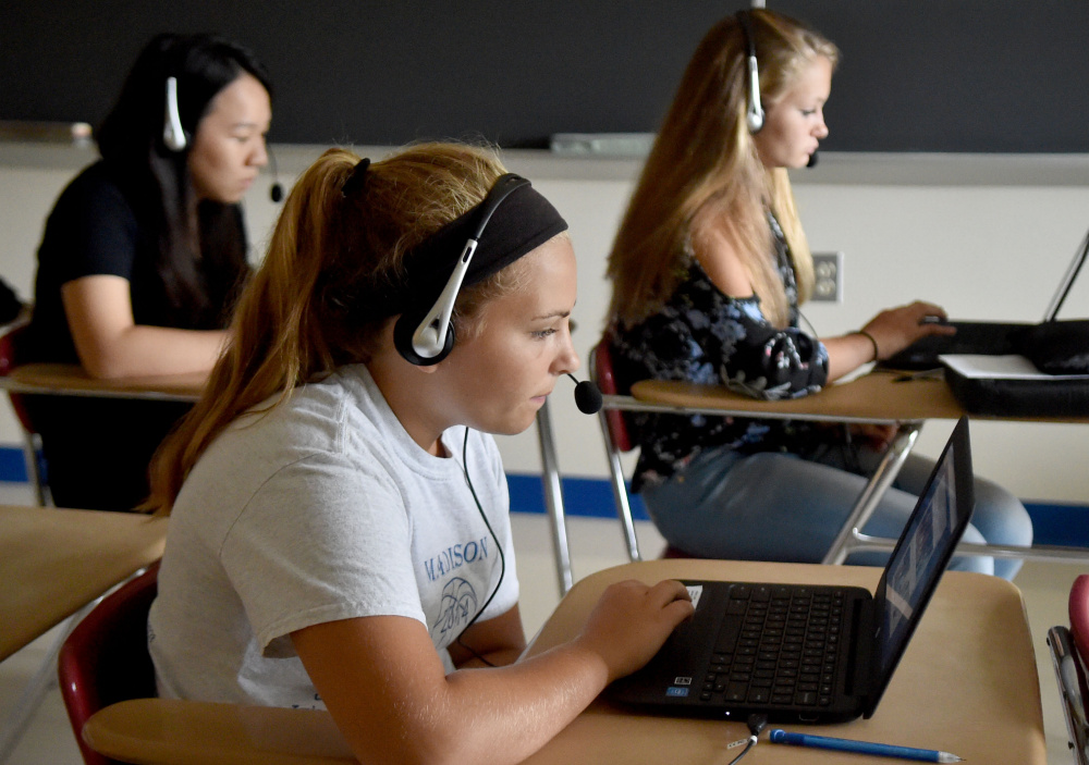 Laurie LeBlanc works on her Spanish language exercises using Rosetta Stone at Madison Area Memorial High School.